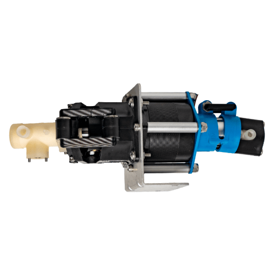 Mechanical dual-head pump component with a mix of beige, black, and metal parts, and a bracket near a black cylindrical section