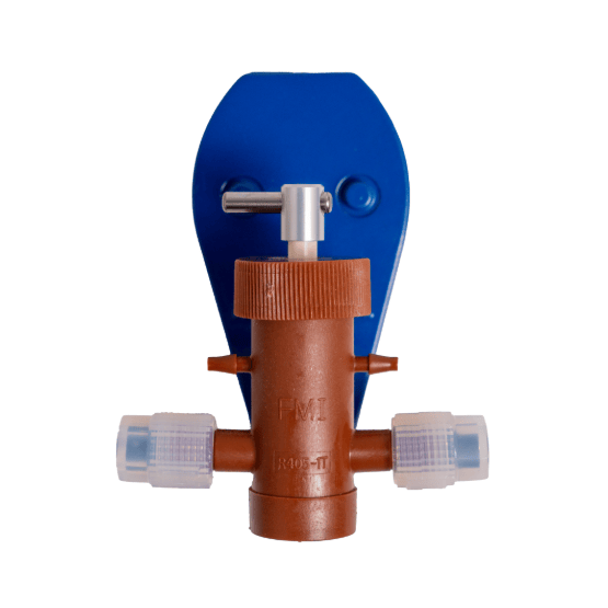Brown-colored pump head assembly mounted on a blue bracket with a ceramic piston on top and transparent tubing connectors