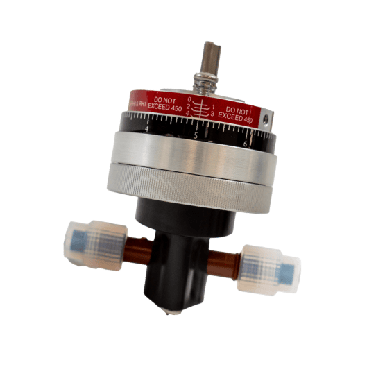 Cylindrical mechanical control pump head dial with red, black, and silver segments, and protruding translucent connectors